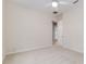 Well-lit bedroom with neutral walls and carpet; a ceiling fan and doorway are also present at 2070 W Lake Hamilton Dr, Winter Haven, FL 33881