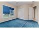 Bedroom with blue carpet and large windows at 2070 W Lake Hamilton Dr, Winter Haven, FL 33881