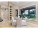 Bright breakfast nook with beautiful view, built in shelves, tile floors, and table with seating at 2070 W Lake Hamilton Dr, Winter Haven, FL 33881