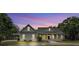 Stunning home exterior at twilight with manicured landscaping and inviting entrance at 2070 W Lake Hamilton Dr, Winter Haven, FL 33881