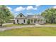 Beautiful home featuring a covered parking area, well-maintained landscaping, and a cozy entrance at 2070 W Lake Hamilton Dr, Winter Haven, FL 33881