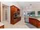 Kitchen with stainless appliances and granite countertop and view to backyard at 2070 W Lake Hamilton Dr, Winter Haven, FL 33881