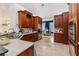 Open kitchen with wood cabinets, stainless appliances, and adjacent dining area at 2070 W Lake Hamilton Dr, Winter Haven, FL 33881
