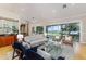 Spacious living room boasting water views, hardwood floors, and large sliding glass doors at 2070 W Lake Hamilton Dr, Winter Haven, FL 33881