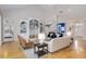 Spacious living room with hardwood floors, built-in shelving and seamless flow at 2070 W Lake Hamilton Dr, Winter Haven, FL 33881