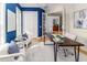 Stylish home office featuring blue accent wall, natural light, and modern decor at 2070 W Lake Hamilton Dr, Winter Haven, FL 33881