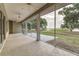 Spacious screened patio offers expansive waterfront views of the surrounding landscape at 2070 W Lake Hamilton Dr, Winter Haven, FL 33881