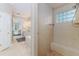 Walk-in shower featuring tile surround, and glass block window at 2070 W Lake Hamilton Dr, Winter Haven, FL 33881