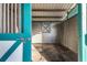Inside a horse stable, featuring a well-maintained stall and access door at 2070 W Lake Hamilton Dr, Winter Haven, FL 33881