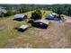 Aerial view showcases the expansive property, complete with various barn structures and ample land at 2171 Sophia S Pl, Lakeland, FL 33811