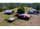 Expansive property featuring multiple structures including a barn and house amid lush greenery at 2171 Sophia S Pl, Lakeland, FL 33811