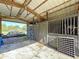 Spacious barn interior with wooden beams, multiple stalls, and ample natural light at 2171 Sophia S Pl, Lakeland, FL 33811