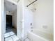 Clean bathroom with a bathtub and shower combination, featuring white tile and a single shower head at 2171 Sophia S Pl, Lakeland, FL 33811