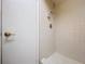Bathroom featuring standing shower and a white door for entry and exit at 2171 Sophia S Pl, Lakeland, FL 33811