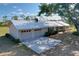 Desirable home with an attached two-car garage, manicured front yard, and metal roof at 2171 Sophia S Pl, Lakeland, FL 33811