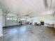 Expansive garage featuring dual garage doors, high ceilings, and abundant space for parking and projects at 2171 Sophia S Pl, Lakeland, FL 33811