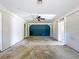 Bright living room featuring laminate flooring, ceiling fan and access to other rooms in the home at 2171 Sophia S Pl, Lakeland, FL 33811