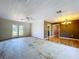 Spacious living room featuring hardwood floors and natural lighting through the french doors at 2171 Sophia S Pl, Lakeland, FL 33811