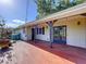 A spacious brick patio provides shade and a great spot for outdoor relaxation, with an AC unit nearby at 2171 Sophia S Pl, Lakeland, FL 33811