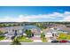 Aerial view of homes in a lakeside community with mature landscaping and inviting streetscapes at 2318 Rush Bay Way, Orlando, FL 32824