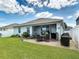 Spacious backyard with patio, privacy fence and well-maintained lawn at 2318 Rush Bay Way, Orlando, FL 32824