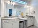 Stylish bathroom with dual sinks, vanity, framed mirror, and recessed lighting at 2318 Rush Bay Way, Orlando, FL 32824