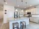 Bright, open kitchen with granite countertops, stainless steel appliances, and center island at 2318 Rush Bay Way, Orlando, FL 32824