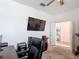 Office with desk, computer, black chair, gray carpet and door to open space at 2318 Rush Bay Way, Orlando, FL 32824