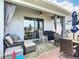 Covered patio with outdoor seating and ceiling fan, perfect for relaxing at 2318 Rush Bay Way, Orlando, FL 32824