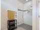 Modern bathroom with glass-enclosed walk-in shower and gray and white tiles at 2318 Rush Bay Way, Orlando, FL 32824