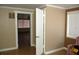 Neutral colored bedroom features tan walls, tile floors and a large bright window at 255 S Pennsylvania Ave, Lake Alfred, FL 33850