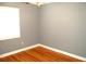Bedroom with hardwood floors and ample natural light at 255 S Pennsylvania Ave, Lake Alfred, FL 33850