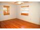 Empty bedroom with hardwood flooring and natural light at 255 S Pennsylvania Ave, Lake Alfred, FL 33850