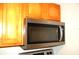 Modern microwave oven installed above the cooktop at 255 S Pennsylvania Ave, Lake Alfred, FL 33850