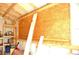 Inside a wooden shed featuring ample storage and structural supports at 255 S Pennsylvania Ave, Lake Alfred, FL 33850