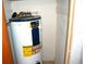Close-up of a water heater with visible energy guide and six-year warranty at 255 S Pennsylvania Ave, Lake Alfred, FL 33850