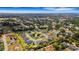 Aerial shot of the neighborhood showcasing the home's location in a lush community at 2551 Delphi Woods Cir, Lakeland, FL 33812