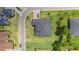 Bird's-eye view of the property with its well-maintained lawn, privacy fence, and spacious layout at 2551 Delphi Woods Cir, Lakeland, FL 33812