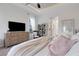 Bright bedroom with soft textures, a dresser, and ample lighting fixtures at 2551 Delphi Woods Cir, Lakeland, FL 33812