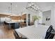 Stylish dining area with open access to a modern kitchen with an island at 2551 Delphi Woods Cir, Lakeland, FL 33812