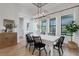 Bright dining room with contemporary light fixture and ample natural light at 2551 Delphi Woods Cir, Lakeland, FL 33812