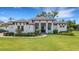 Stunning, contemporary-style home with manicured lawn and charming walkway at 2551 Delphi Woods Cir, Lakeland, FL 33812