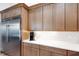 A kitchen featuring stainless steel refrigerator, ample counter space, and modern appliances at 2551 Delphi Woods Cir, Lakeland, FL 33812