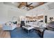 Open-concept living room with high ceilings and a cozy, inviting atmosphere at 2551 Delphi Woods Cir, Lakeland, FL 33812