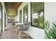 Relaxing screened patio with high-top seating and views of the landscaped backyard at 2551 Delphi Woods Cir, Lakeland, FL 33812