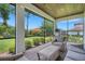 Relaxing screened patio with comfortable seating and views of the landscaped backyard at 2551 Delphi Woods Cir, Lakeland, FL 33812