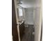 Bathroom with a walk-in shower, window, and vanity with wood cabinets at 2621 Island Oaks W, Lakeland, FL 33805
