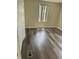 Neutral bedroom with wood-look flooring and window for natural light at 2621 Island Oaks W, Lakeland, FL 33805