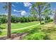 Scenic view of lush green golf course with trees and manicured landscaping at 2660 Hemingway Ave, Haines City, FL 33844