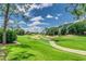 Beautiful view of a well-maintained golf course with sand traps and green fairways at 2660 Hemingway Ave, Haines City, FL 33844
